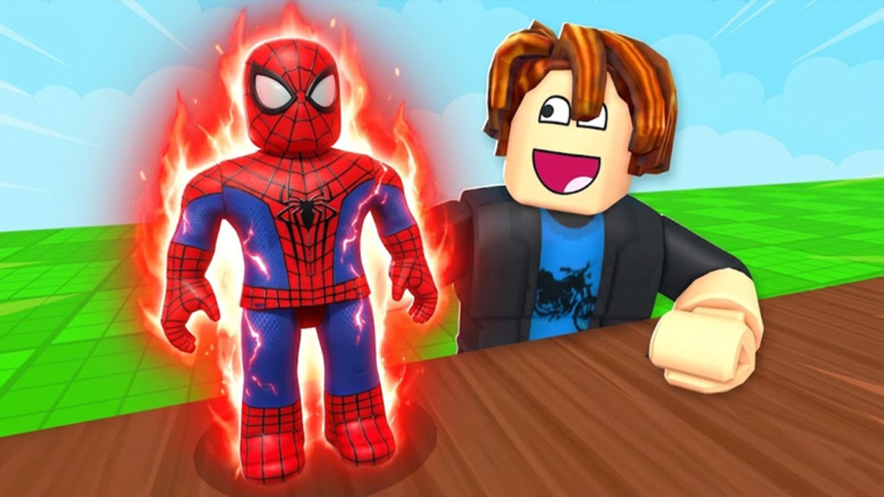 A Spin a Superhero player standing beside a Spider-Man unit glowing on a plot pad